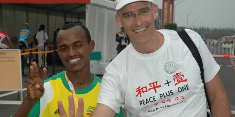 Kebede Tsegaye, Bronze Medal Athlete in Mens Olympic Marathon shares Peace Plus One Sustainability Symbol...