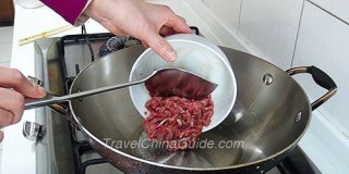 Pour Processed Beef into Wok